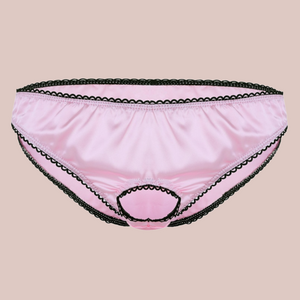 Pale pink satin panties from House Of Chastity, you can see the black edging which is also around the open ring front.