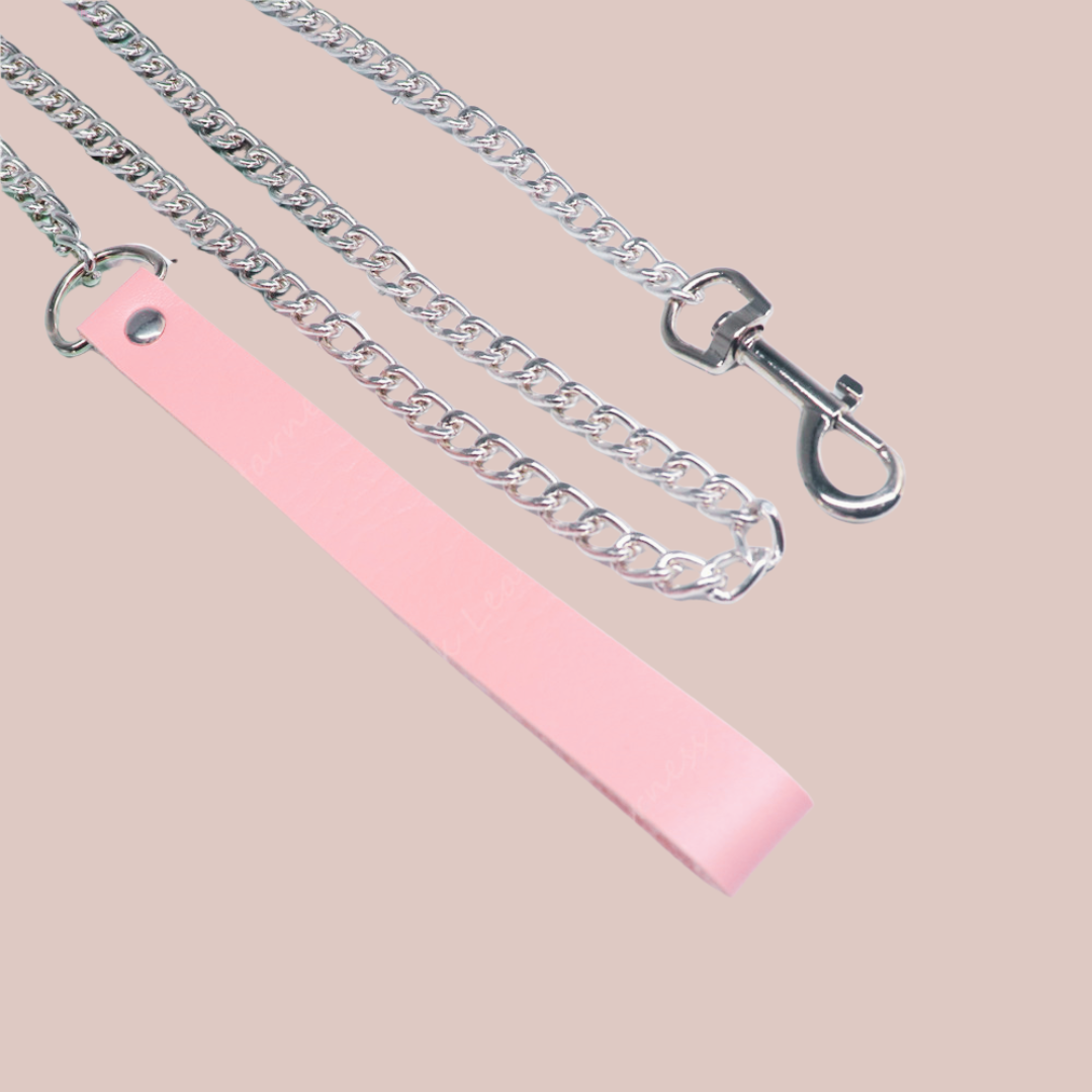 The pink handle and silver chain lead.