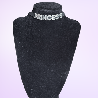An image of the Princess necklace on a necklace model in front of a purple background
