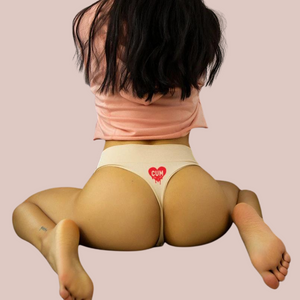 The rear view of the panties, you can see the g-string design and the cum motif on the rear.