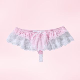 The pink panties laying out flat on a pink background