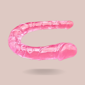 Showing the Small Pink Jelly Double Ended Dildo from House Of Chastity, you can see the two ends that differ in size, it has a lovely pink tone whilst being see-through.