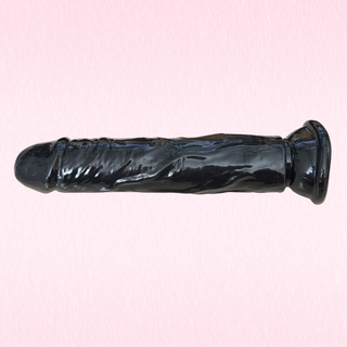A side view of the dildo, the glossy colouring is clear to see.
