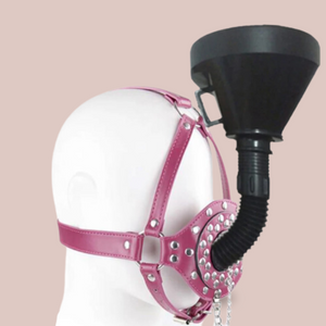Shown here is the pink faux leather studded head gag with removable funnel fixed in place.