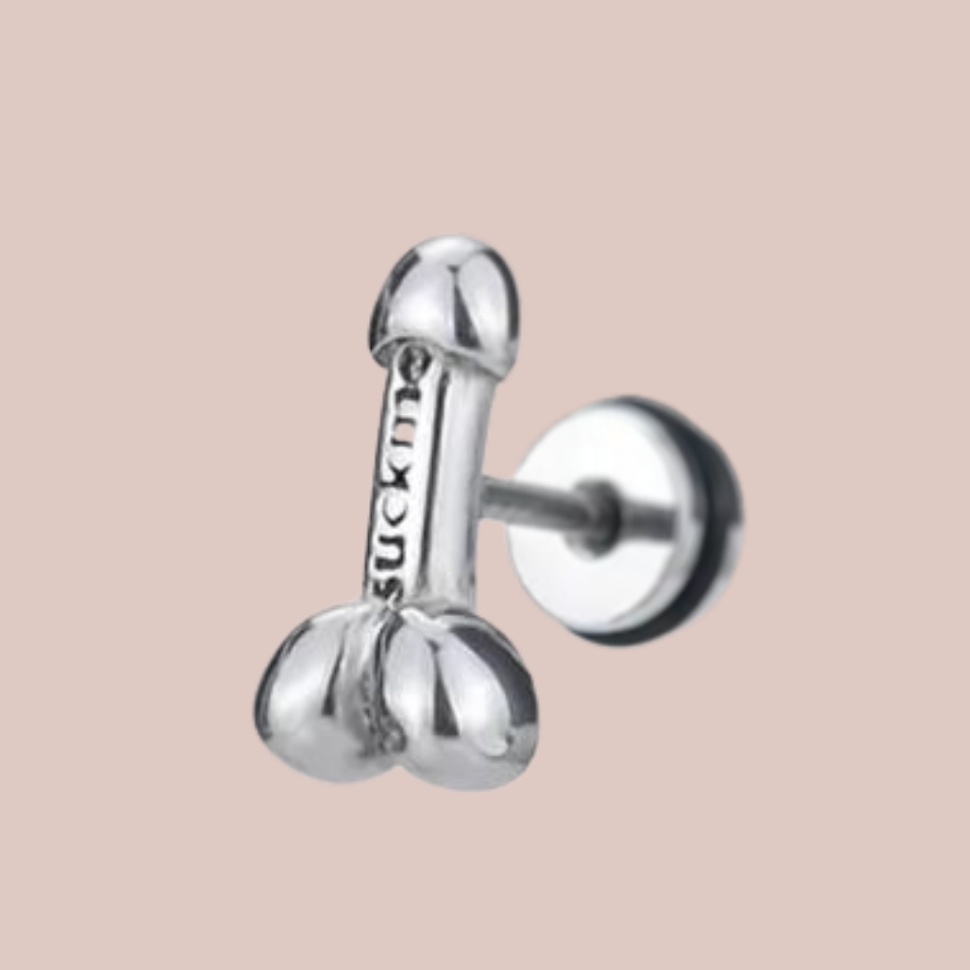 A close up of the siver penis earriings, you can see the they are shaped like a penis with a head and balls.