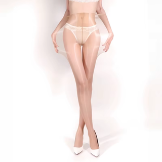 The Super Stretch Gloss tights shown here in nude, the model is showing the stretch available in the tights.