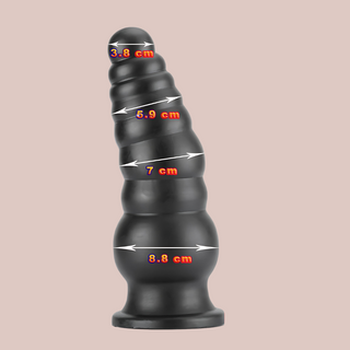 The super large dildo is shown here with the different range of diamaters that make up its length.