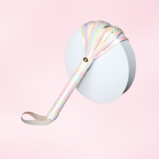 The flogger is shown displayed on a pink background