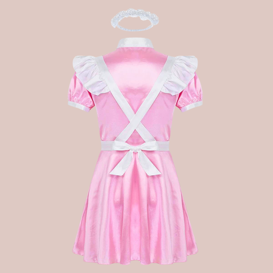 Back view of the Belinda sissy maids dress, it has a full skirt, the apron crosses over the back and ties at the waist, the satin headband can e seen above the outfit.