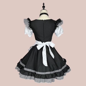 The rear view of The Bella maids dress from House Of Chastity, you can see that it has a zipper fastening and you can see that the apron has been tied and is removable.