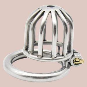 Placed on its back, The Bird House Stainless Steel chastity device shows off the length of the chastity cage, whilst offering up the base ring in place.