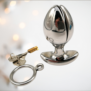 The Blossoming Dilator from House Of Chastity shown a a closed bud with the handle, lock and keys.