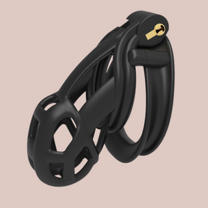 A close up of the fully assembled Cobra Double Cuff Matte Black Small chastity cage.