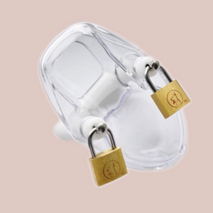 A singular view of the clear Cock Suppression Chastity Cage, shown with the two padlocks in place.