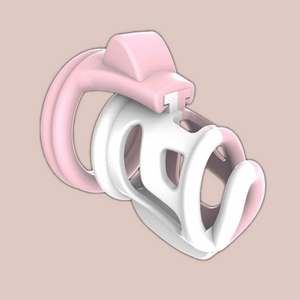 The fifi is a half pink and half white chastity cage that has a connecting pink base ring. The two tone style of the chastity deviceis shown in this picture.