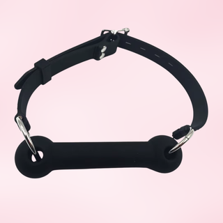 A view from above of the Giddy Up Gag on a pink background