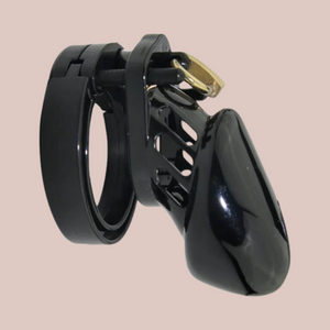 A black medical grade plastic chastity cage that is shown in small size. This product has a chastity cage, different sized base rings, an external padlock and extra numbered locks.