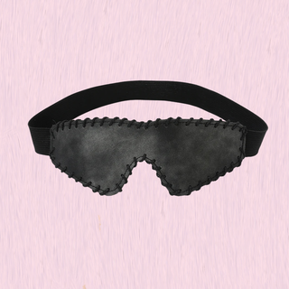 The eye mask on a pink background
