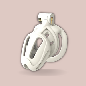 An angled view of The Kidding Zone 3D in white, you can see it fully assembled and with the integral lock in place. This chastity cage is fitted with a flat base ring.