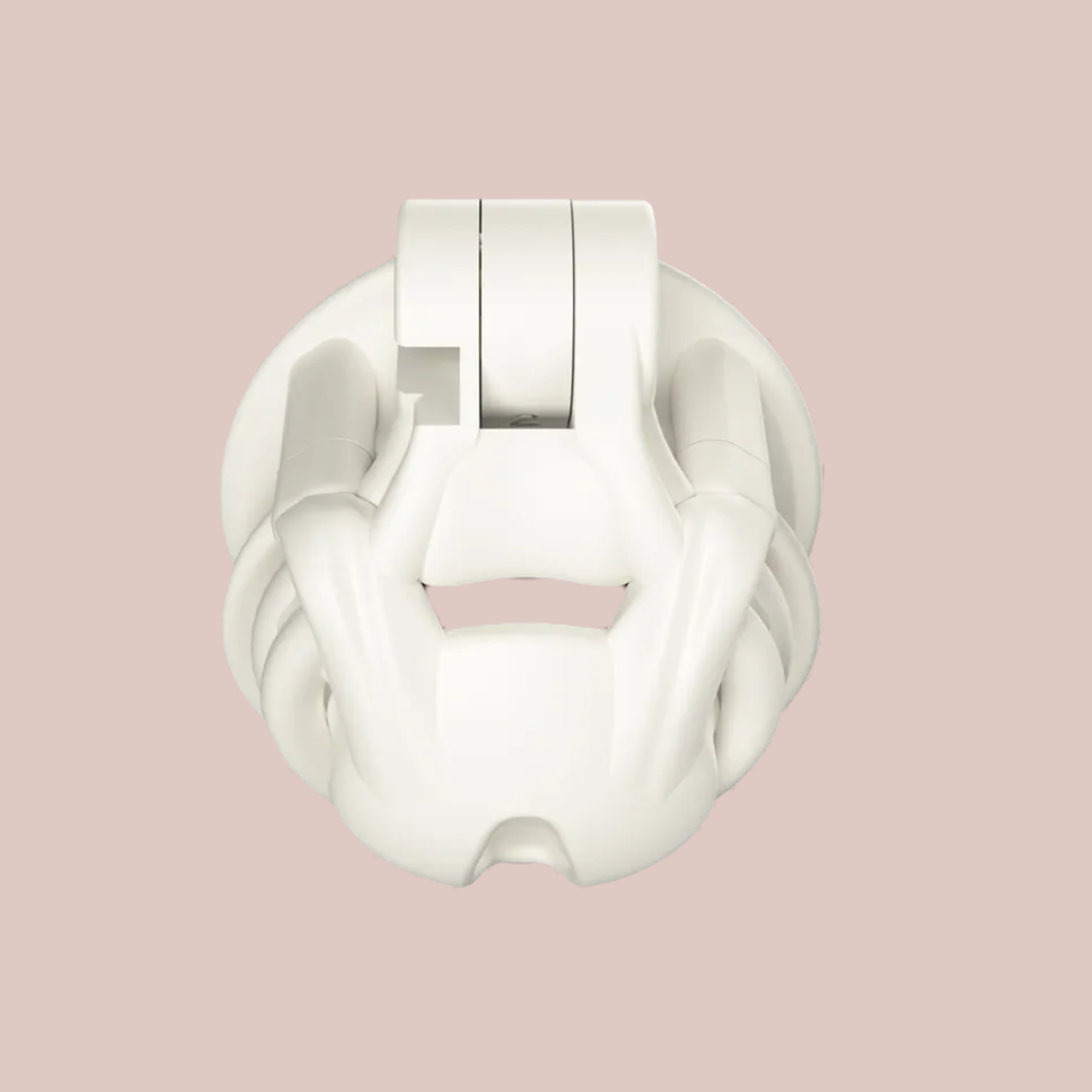 A front view of The Python chastity cage in white from House Of Chastity, it is shown here fully assembled.