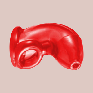 The red slide on chastity cage, shown at an angle.