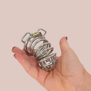 The fully assembled Starburst chastity cage, shown being held to give an idea of size.