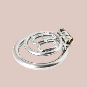 The Thrall chastity device is shown lying on its base ring, it gives you an idea of depth.