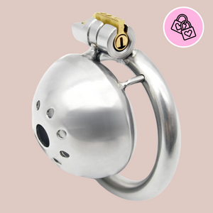 A front on view of the Ultra chastity cage, you can see the centre hole and the patterned circle of holes that surround it to allow air to circulate. From this angle you can see the base ring and how it attaches to the cock cage, along with the integral lock in place.