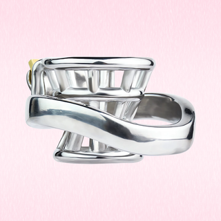 An angled view of the cage sitting on its base, the stainless steel is sturdy enough to make sure that the wearer is locked in.