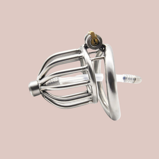 A side view of The Bird House, the metal cage is shown with the urethral tube in place and the integral lock fixing the base to the chastity device.