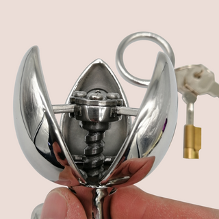 The Blossoming Dilator from House Of Chastity is shown close up, it has been opened to its full extent.