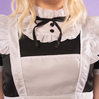 A close up of the high neck collar with decorative bow and buttons.