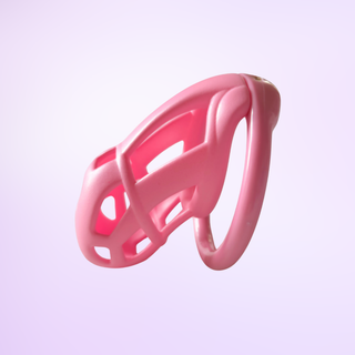 A side view of the fully assembled Cobra Naja chastity cage on a pink background