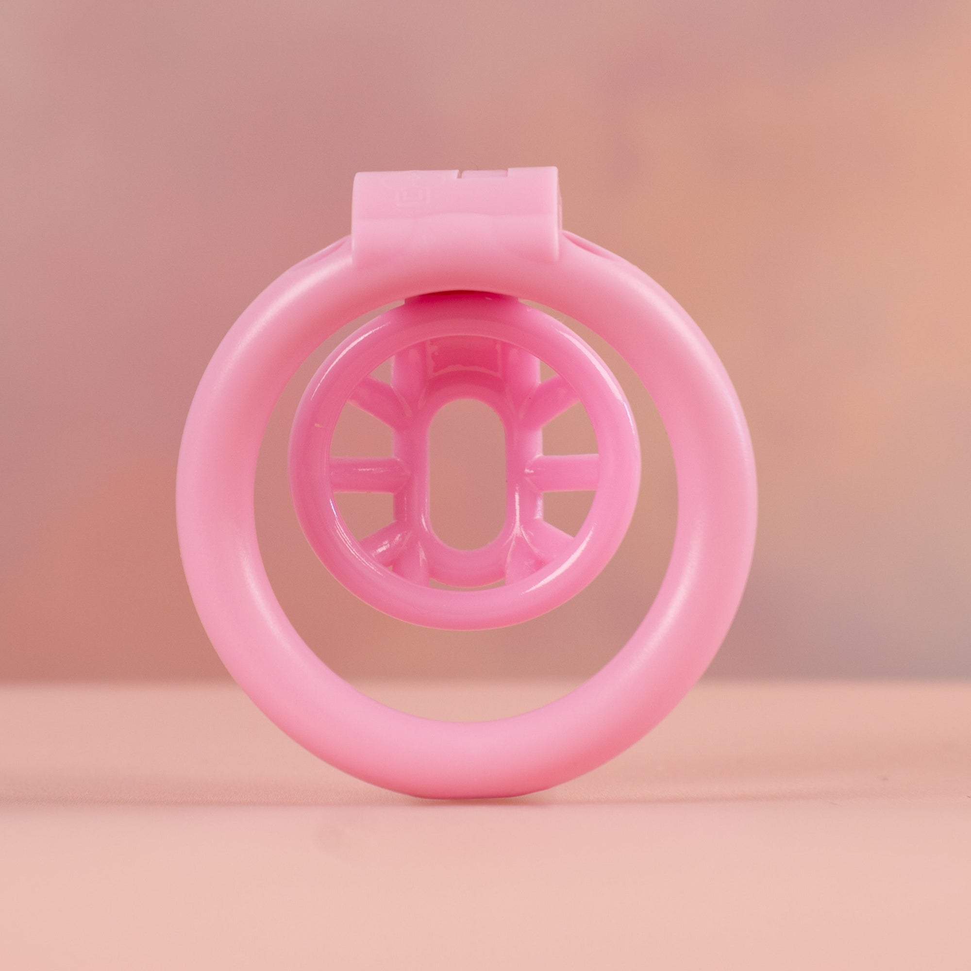 A rear view of the Cobra Nub Micro chastity cage.
