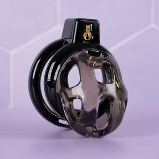 The Custodian black chastity cage shown fully assembled but without the urethral tube fitted.