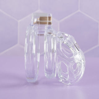 a side view of the transparent chastity cage shown fully assembled.