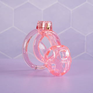 an angled view of the pink Custodian chastity cage, you can see that the cage has been designed for air flow.