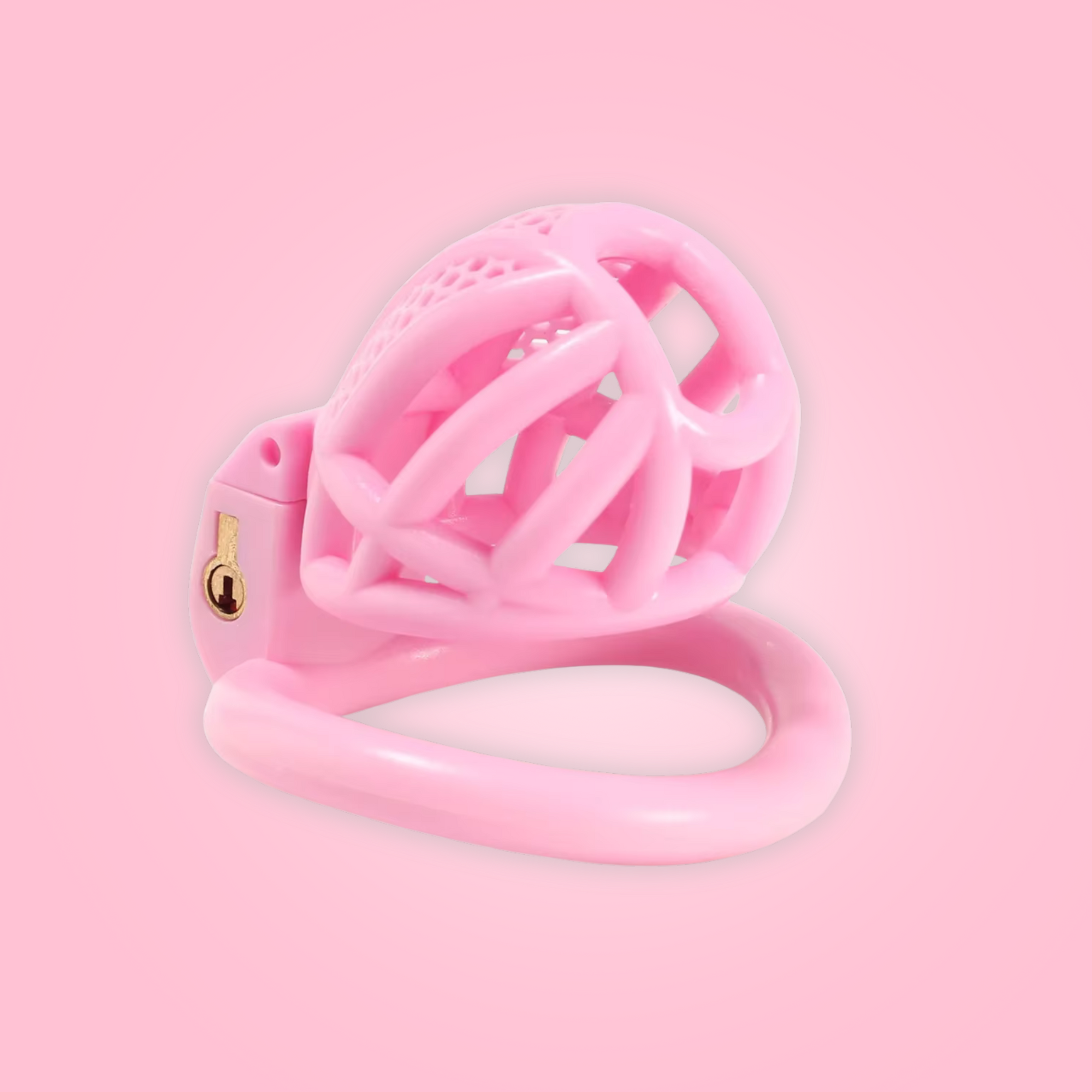 The Detained small shown here in pink, the cage is shown sitting on its base ring and you can see the underside of the chastity cage.