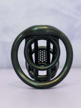 A rear view of the Detained V2 chastity cage, the under side of the cage can be seen, showing that the cut out design is carried throughout the cage.