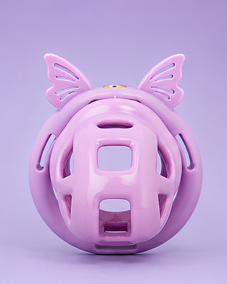  A front on view of the chastity cage fully assembled, it is shown on a purple backgrround.