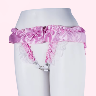 An angled view of the chastity belt on a static model, the clips for the chastity cage are clear to see.