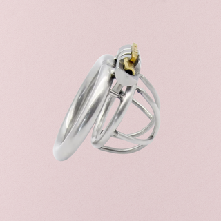 A side view of the The Lock Up Nub Metal chastity cage, it is shown assembled with the cage attached to the base ring and the integral lock in place.