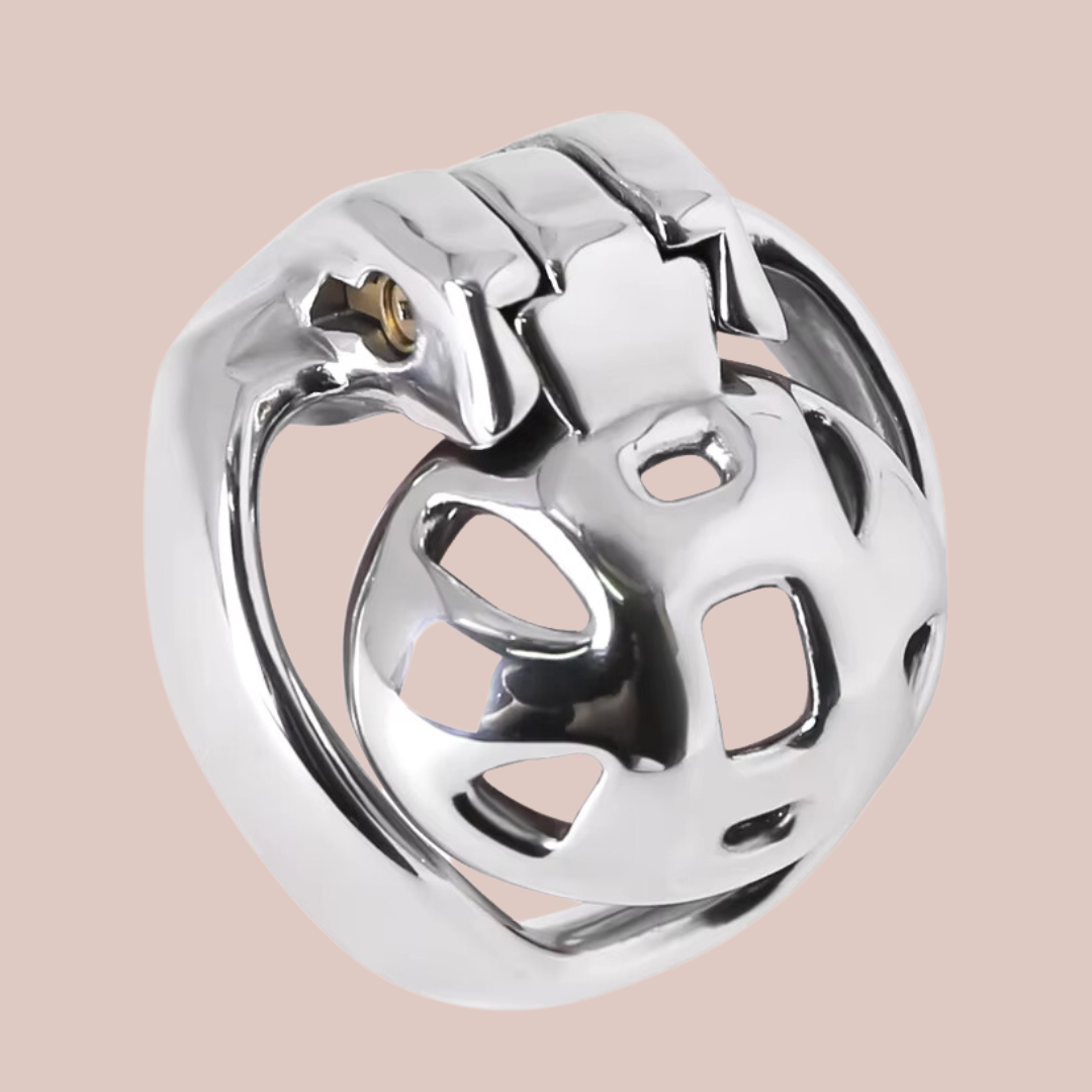 A side profile of the The Mamba Nub Metal Chastity Cage, you can see the cage attached to the base ring and locked into place by the integral lock.