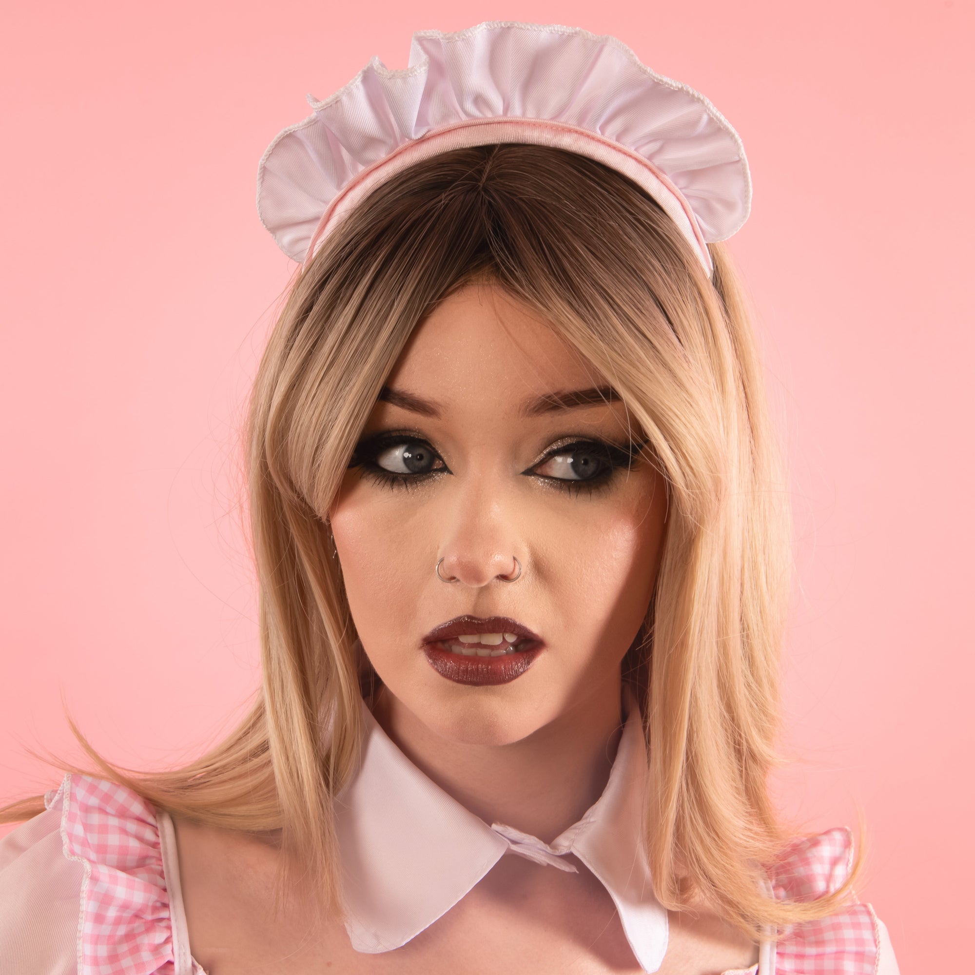 Our model is showcasing the frilled headband that is included with this dress. 