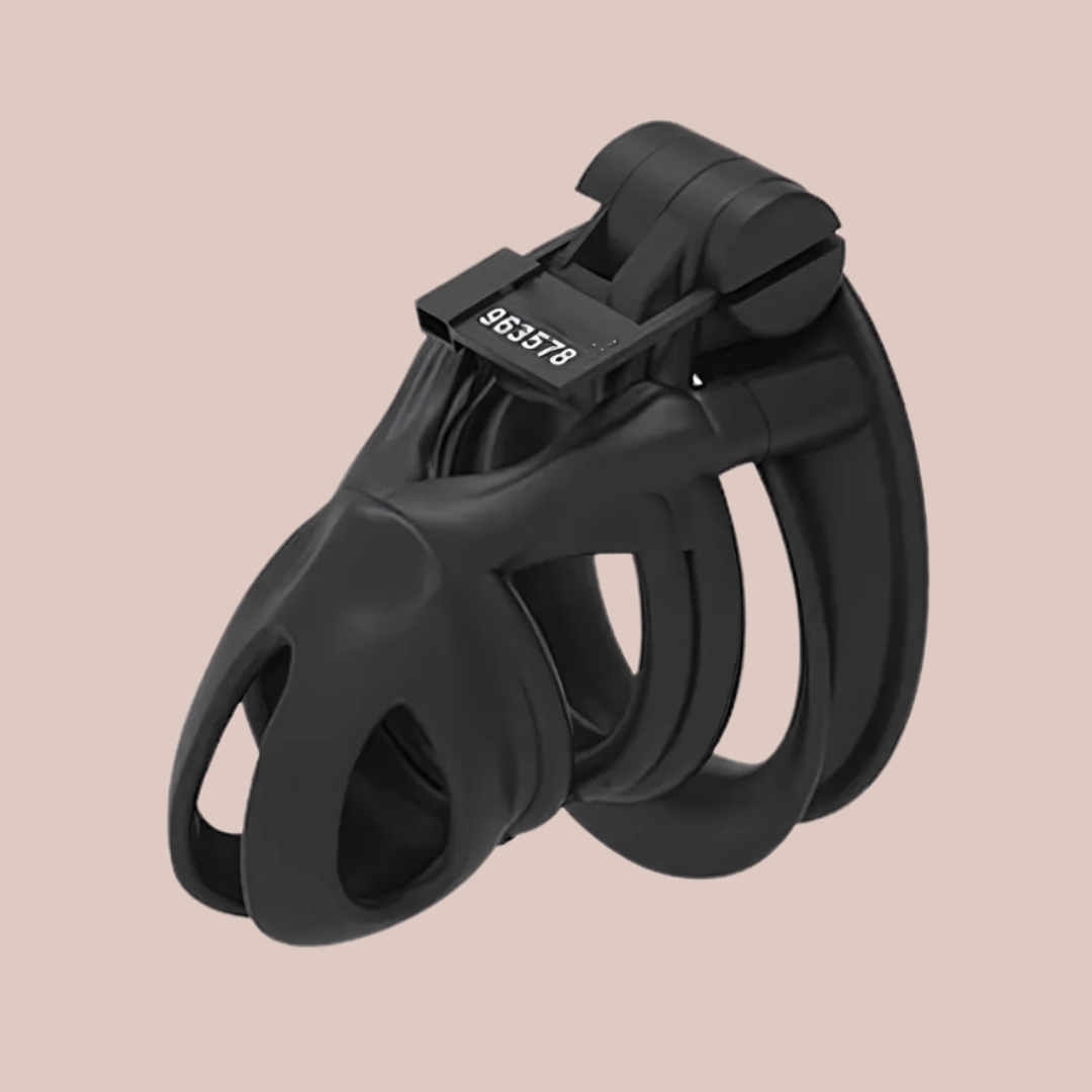 A side view of the Python Standard chastity cage from House Of Chastity, it is fully assembled into its double cuff style base ring and the integral lock is fixed in place.