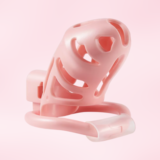 An angled view of the Sevanda Chastity cage, it is sitting on its base ring, showing the underside of the cage.