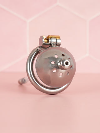 The Ultra stainless steel chastity cage shown here fully assembled with its urethral tube fixed in place.