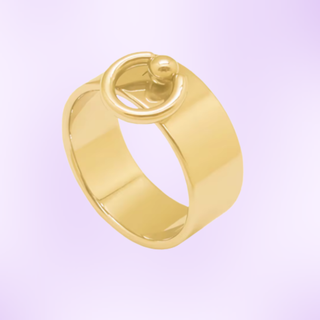 The gold ring set on a purple background