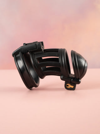 A side on view of the slaver chastity cage. 