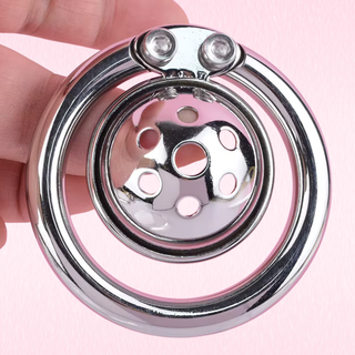 A close up view of The Ultra Micro, you can see how the chastity cage is locked by an Allen Key and how the cage is nestled flat to the base ring.